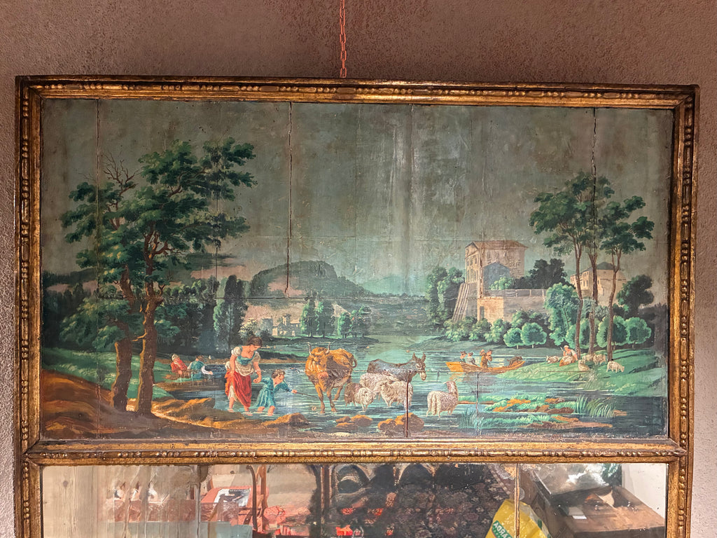 Caminiera dorata con paesaggio